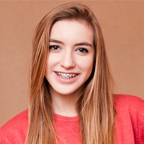 Teen girl with braces and orthodontic appliance
