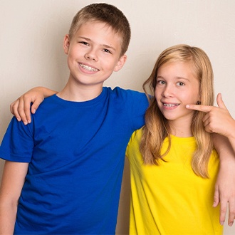 Preteen boy and girl with pediatric orthodontics
