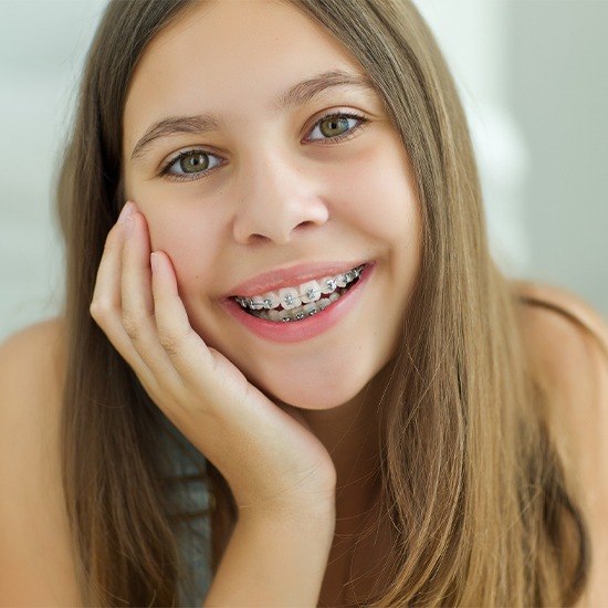 Teen girl with self ligating braces smiling